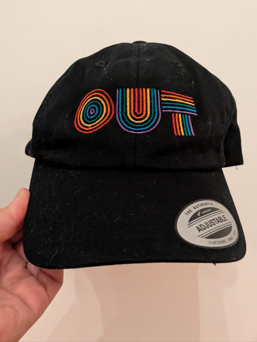 Yupoong The Classics Black "OUT" Rainbow Embroidered Adjustable Dad Hat OSFA
